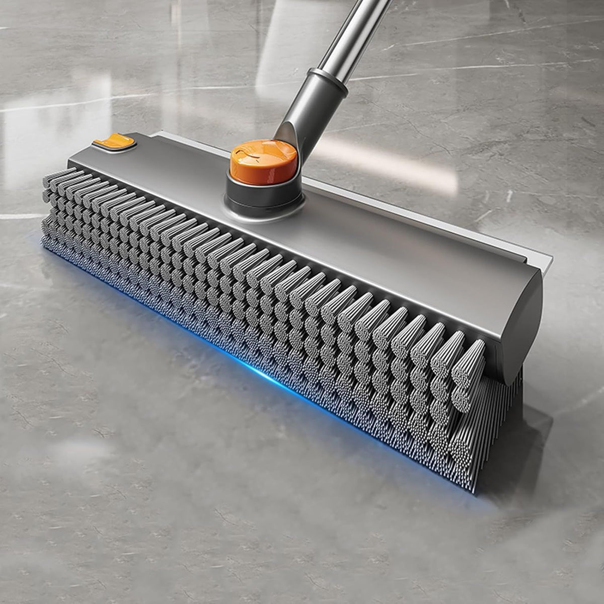 Cleaning tool with bristle brush on a gray surface