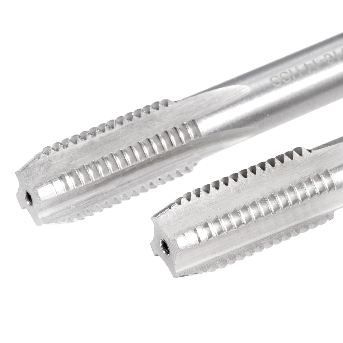 Two metallic tools with teeth on a white background