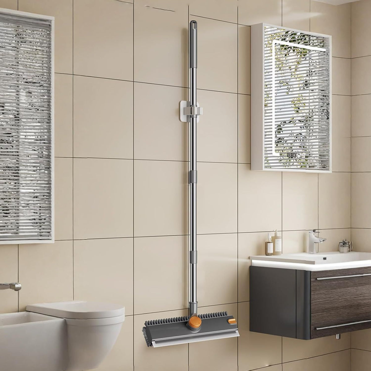 Bathroom with tiled walls, a toilet, sink, and cleaning brush with orange bristle head.