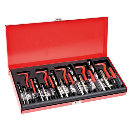 Set of drill bits in a red toolbox on a white background